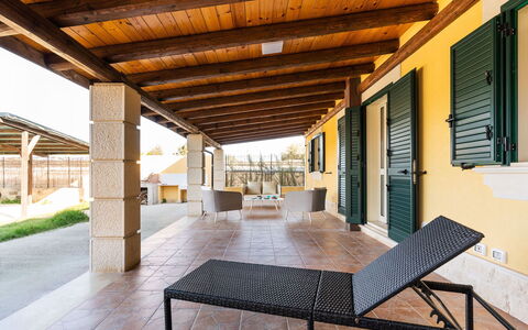 Casa sul Mare: Flooring, Floor, Furniture, Shade, Outdoor Furniture, Wood Stain, Chair, Porch, Eco Hotel, Hardwood