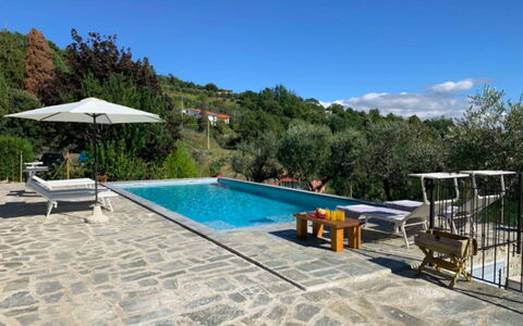 Villa Sarzana: Swimming Pool, Flagstone, Outdoor Furniture, Composite Material, Resort, Tile, Shade, Chair, Leisure, Eco Hotel