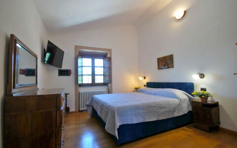 Villa Sarzana: Furniture, Home, Ceiling, Bedroom, Light Fixture, Bed Frame, Lamp, Bed, Picture Frame, Hardwood