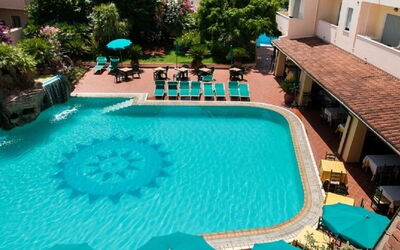 Apartments In Golfo Orosei: Swimming Pool, Water, Resort, Town, Furniture, Eco Hotel, Thermae, Leisure, Outdoor Furniture, Water Feature