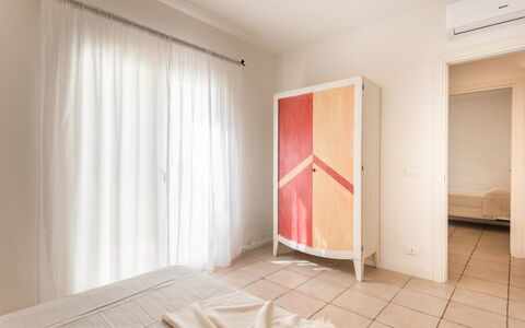 Baia Bianca Apartments Sardinia: Interior Design, Floor, Furniture, Flooring, Wood, Bedroom, Ceiling, Textile, Room, Bed