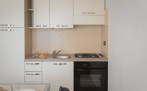 Le Fontane Apartments In Villasimius: Kitchen, Kitchen Appliance, Major Appliance, Countertop, Cabinetry, Wood, Interior Design, Kitchen Stove, Stove, Flooring