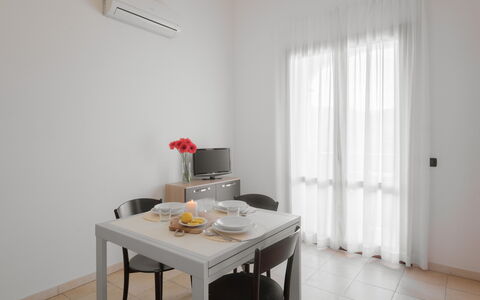Le Fontane Apartments In Villasimius: Furniture, Interior Design, Flooring, Floor, Chair, Room, Kitchen & Dining Room Table, Ceiling, Apartment, Dining Room