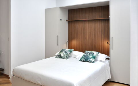Suite Trastevere: Furniture, Wood, Bedroom, Interior Design, Flooring, Floor, Bed, Bedding, Bed Sheet, Room