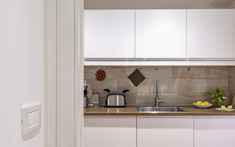 Suite Trastevere: Kitchen, Kitchen Appliance, Countertop, Interior Design, Major Appliance, Cabinetry, Wall, Flooring, Wood, Furniture