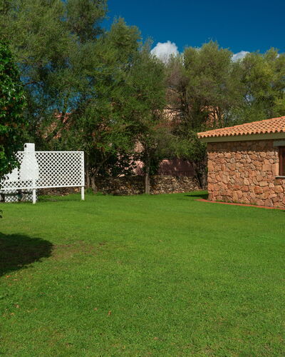 San Teodoro Apartments: Garden, Shade, Lawn, Backyard, Swimming Pool, Landscaping, Yard, Hacienda, Farmhouse
