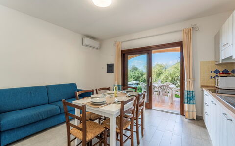 Apartment Sardinia Seaside Ac And Wifi: Kitchen & Dining Room Table, Outdoor Furniture, Chair, Wood Stain, Shade, Outdoor Table, Hardwood, Balcony, Eco Hotel, Villa