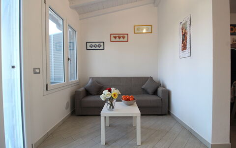 Villetta Elena, Ac, Wifi, Lido Degli Scacchi: Furniture, Interior Design, Flooring, Couch, Wood, Floor, Room, Living Room, Apartment, Home