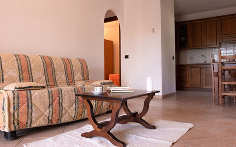 Violet Residence In Orosei: Furniture, Interior Design, Flooring, Wood, Floor, Room, Apartment, Wood Flooring, Wood Stain, Living Room