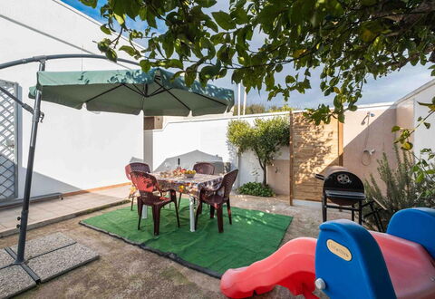 Sunny Haven Villa In Torre Lapillo: Garden, Shade, Flowerpot, Outdoor Furniture, Yard, Backyard, Landscaping, Courtyard, Chair, Houseplant