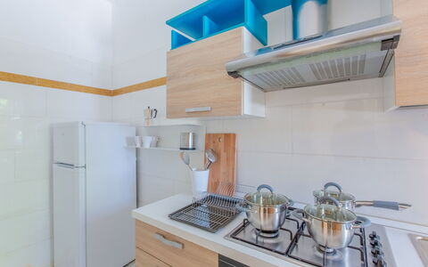 Villa Asami: Kitchen, Kitchen Appliance, Countertop, Major Appliance, Flooring, Interior Design, Cabinetry, Wood, Furniture, Floor