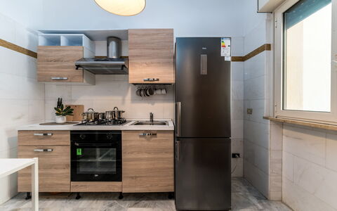 Villa Coralia: Kitchen Appliance, Kitchen, Major Appliance, Cabinetry, Countertop, Wood, Furniture, Interior Design, Home Appliance, Flooring
