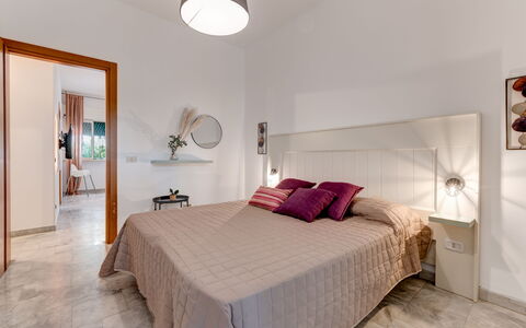 Villa Coralia: Furniture, Interior Design, Bed, Flooring, Bedroom, Wood, Floor, Ceiling, Room, Bed Sheet