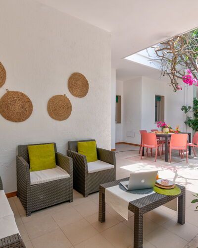 Villa Coralia: Furniture, Flooring, Interior Design, Floor, Chair, Ceiling, Room, Living Room, Houseplant, Kitchen & Dining Room Table