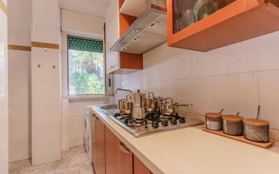 Villa Nami: Kitchen, Kitchen Appliance, Countertop, Major Appliance, Wood, Flooring, Interior Design, Kitchen Sink, Floor, Cabinetry