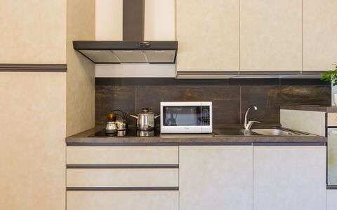 Villa Eufriama: Kitchen, Countertop, Kitchen Appliance, Cabinetry, Interior Design, Wood, Furniture, Major Appliance, Flooring, Home Appliance