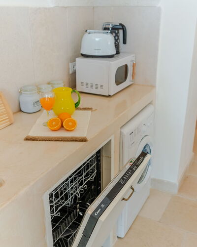 Casa Lea: Interior Design, Flooring, Countertop, Floor, Room, Kitchen, Home Appliance, Cabinetry, Kitchen Appliance, Tile