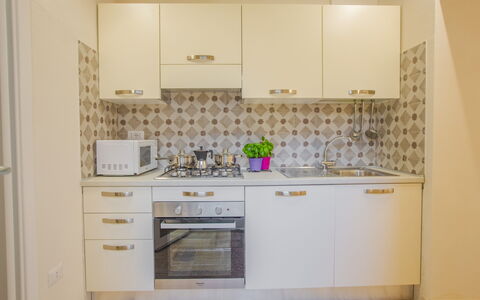 Casa Ettore: Kitchen Appliance, Kitchen, Major Appliance, Countertop, Cabinetry, Wood, Flooring, Interior Design, Floor, Kitchen Stove