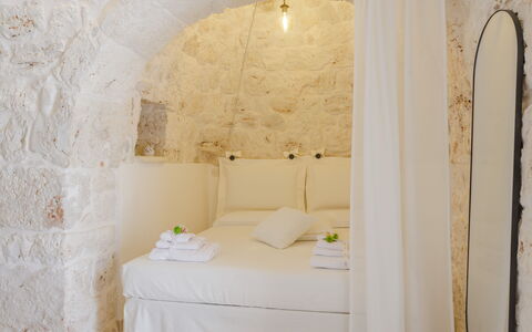 Trullo Quattro Carrini: Bedroom, Linens, Bed, Bedding, Bed Sheet, Stone Wall, Pillow