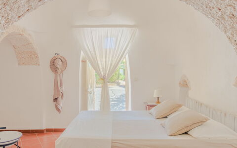 Trullo Poggio Con Piscina: Wall, Ceiling, Interior Design, Floor, Furniture, Bedroom, Chair, Hotel, Bed, Pillow