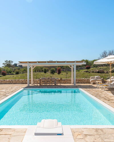 Masseria Le Monache: Swimming Pool, Composite Material, Outdoor Furniture, Resort, Chair, Shade, Landscaping, Garden, Eco Hotel, Flagstone
