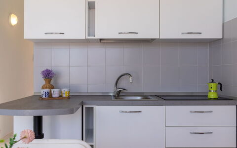 Badesi 10: Kitchen, Countertop, Furniture, Cabinetry, Kitchen Sink, Kitchen Appliance, Interior Design, Plumbing Fixture, Sink, Tap