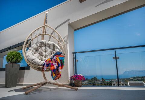 Attico Sea View: Furniture, Interior Design, Chair, Outdoor Furniture, Natural Material, Wood Flooring, Living Room, Wicker, Houseplant, Design