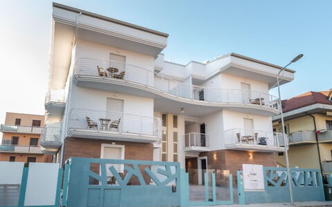 Residence Near The Sea - Abruzzo: Architecture, Balcony, Home, Composite Material, Apartment, Door, Concrete, Stairs, Handrail, Daylighting