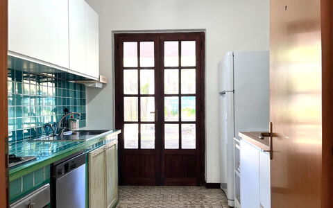 Villasimius 674: Kitchen, Flooring, Interior Design, Floor, Countertop, Wood, Furniture, Kitchen Appliance, Sink, Cabinetry