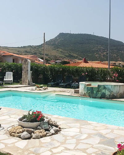 Residenza Agnese Sardegna: Swimming Pool, Resort, Outdoor Furniture, Leisure, Flagstone, Water Feature, Eco Hotel, Umbrella, Shade, Hacienda