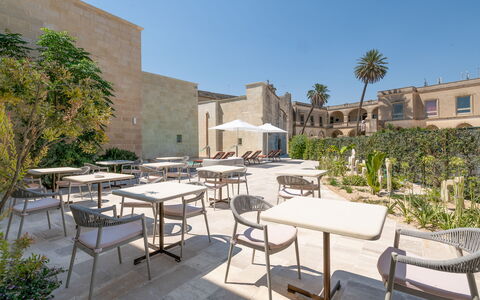 Palazzo Corte Dei Granai: Courtyard, Hacienda, Estate, Landscaping, Garden, Shade, Yard, Chair, Mansion