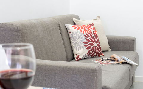 La Rondine Apartment: Furniture, Interior Design, Couch, Cushion, Throw Pillow, Textile, Living Room, Flooring, Pillow, Home