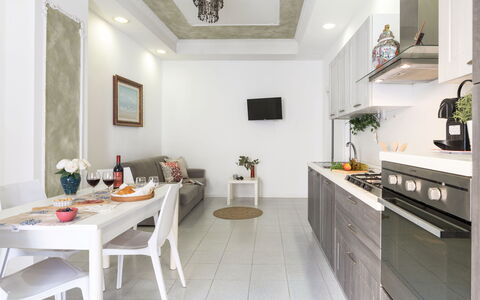 La Rondine Apartment: Furniture, Interior Design, Flooring, Kitchen, Wood, Major Appliance, Kitchen Appliance, Home, Ceiling, Countertop