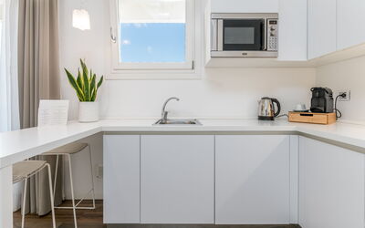 Suite Terra - Raro Rooms Collection - Santo Stefan: Kitchen, Countertop, Furniture, Interior Design, Kitchen Appliance, Cabinetry, Wood, Flooring, Major Appliance, Room