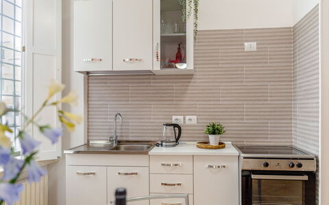 Movie Suite Jesi: Kitchen, Countertop, Kitchen Appliance, Cabinetry, Major Appliance, Furniture, Wood, Interior Design, Kitchen Sink, Home