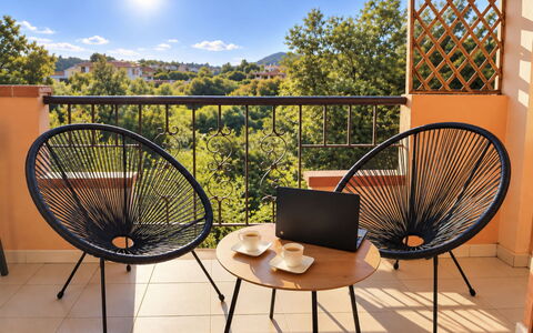 Harmony - Holiday and Workation: Furniture, Outdoor Furniture, Chair, Outdoor Table, Wood Stain, Balcony, Shade, Hardwood, Armrest, Coffee Table