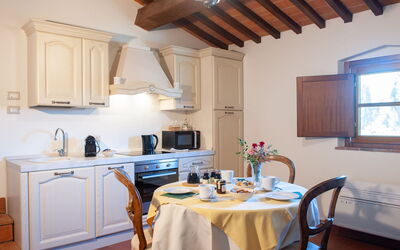 Appartamento Ausonia: Furniture, Interior Design, Wood, Flooring, Kitchen, Ceiling, Room, Cabinetry, Countertop, Kitchen Appliance