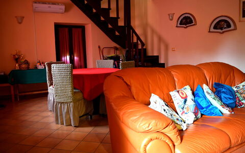 Casa Carletto, Abruzzo: Furniture, Interior Design, Flooring, Floor, Room, Orange, Lighting, Living Room, Couch, Ceiling