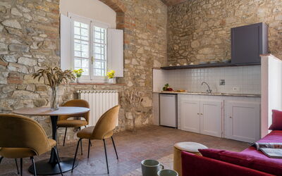 Relais Badia a Passignano - Appartamento Sauvignon: Furniture, Wall, Interior Design, Flooring, Table, Chair, Floor, Room, Ceiling, Living Room