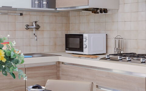 Suite Acquamare: Kitchen, Countertop, Kitchen Appliance, Furniture, Cabinetry, Interior Design, Sink, Flooring, Wood, Major Appliance