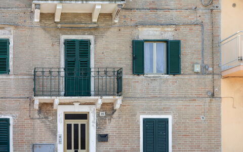 Suite Acquamare: Wall, Door, Composite Material, Window Covering, Home Door, Balcony, Brick, Window Treatment, Daylighting