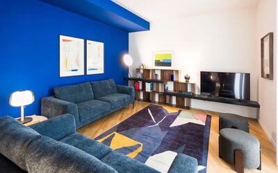 Il Monumento: Furniture, Blue, Interior Design, Flooring, Wall, Couch, Floor, Ceiling, Living Room, Room