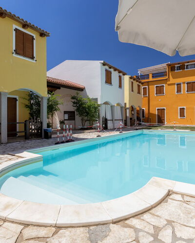 Luce del Mare: Swimming Pool, Town, Residential Area, Home, Human Settlement, Composite Material, Resort, Outdoor Furniture, Sunlounger, Hotel