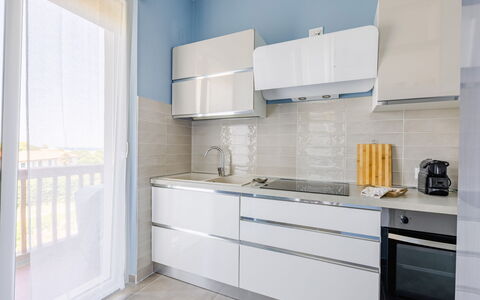Altamarea Apartment: Cabinetry, Kitchen, Flooring, Countertop, Major Appliance, Kitchen Appliance, Interior Design, Wood, Furniture, Floor