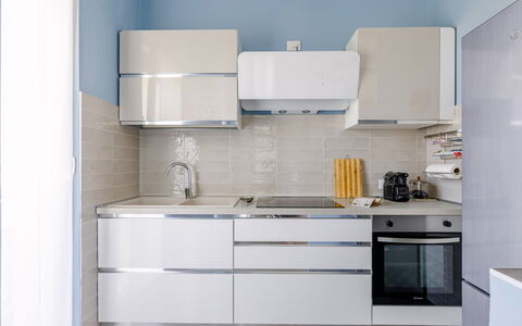 Altamarea Apartment: Kitchen Appliance, Kitchen, Cabinetry, Countertop, Major Appliance, Flooring, Furniture, Interior Design, Wood, Home Appliance