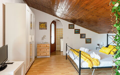 Sopraloreto Apartment: Furniture, Interior Design, Bed, Floor, Flooring, Bedroom, Room, Wood, Ceiling, Bedding