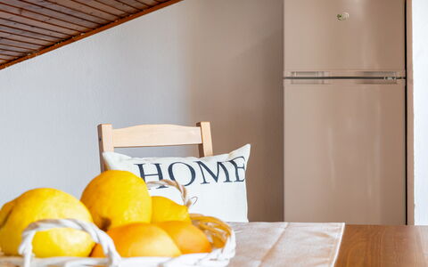 Sopraloreto Apartment: Furniture, Interior Design, Kitchen Appliance, Room, Major Appliance, Home Appliance, Cabinetry, Wood Stain, Hardwood, Refrigerator