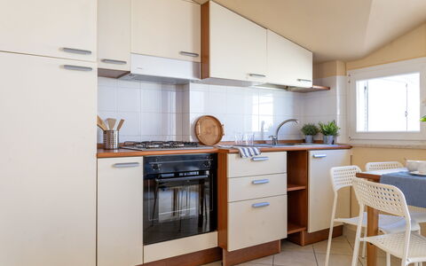 Sweet Conero: Kitchen Appliance, Kitchen, Major Appliance, Wood, Flooring, Countertop, Cabinetry, Interior Design, Floor, Furniture