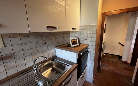 Appartamento Del Mercato: Kitchen, Countertop, Flooring, Kitchen Appliance, Kitchen Sink, Wood, Major Appliance, Floor, Cabinetry, Plumbing Fixture