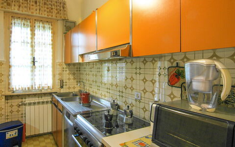 Butterfly Apartment In Lucca: Kitchen, Countertop, Kitchen Appliance, Major Appliance, Kitchen Sink, Interior Design, Flooring, Cabinetry, Kitchen Stove, Lighting